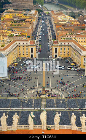 Aerial view of Rome and the Vatican city.  St Peter's square from the  Basilica dome. Preparations for the Easter Service - empty chairs, and tourists Stock Photo