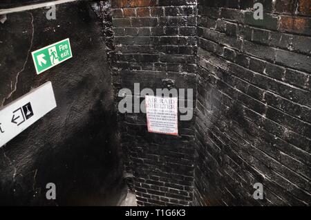 air raid shelter sign at south kentish town abandoned underground station london Stock Photo