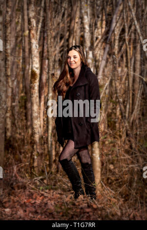 Pretty girl in the forest Stock Photo - Alamy