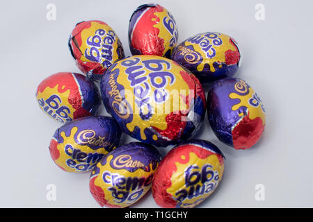 Cadbury creme egg in different sizes as Easter treat Stock Photo