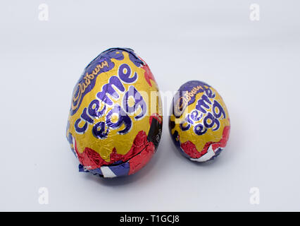 Cadbury creme egg in different size on white background Stock Photo