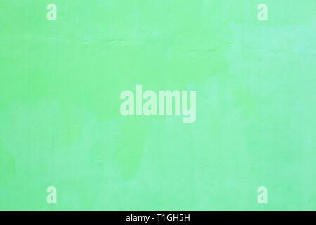 freshly painted light green colored plain seamless grunge textured plastered rough wall background in rustic Asian house. Home Interior Architectural  Stock Photo