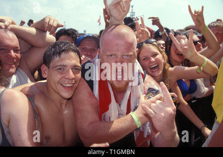 Front row concert fans are shown during Woodstock 94 in Saugerties, New York. Stock Photo