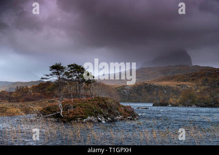 Suilven in cloud over a stormy Loch Druim Suardalain, Glen Canisp, Assynt, Sutherland, Scotland, UK Stock Photo