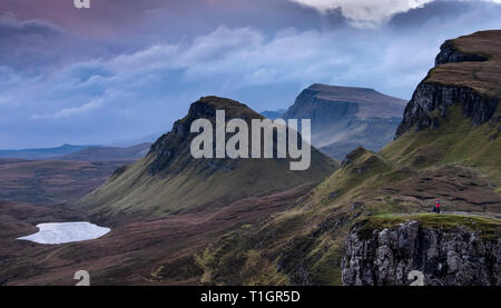 Photographer on the Quiraing at dawn, Trotternish peninsula, Isle of Skye, Inner Hebrides, Scotland, UK MODEL RELEASED Stock Photo