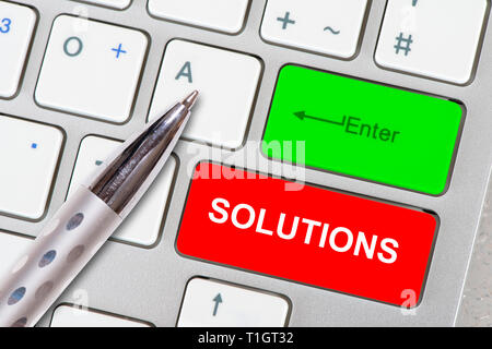 solutions printed on computer keyboard Stock Photo