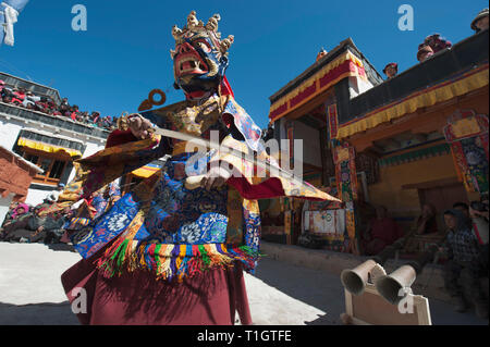 Mask Mahakala with a big sword performs the Cham Dance in a Buddhist monastery. Stock Photo