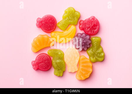 Fruit jelly candies on colorful background. Stock Photo