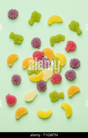 Fruit jelly candies on colorful background. Stock Photo
