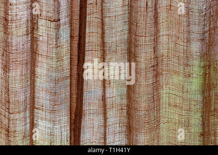 beige canvas texture with delicate mesh pattern as abstract background. Stock Photo