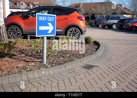 March 2019 - Way out sign in a hotel car park Stock Photo