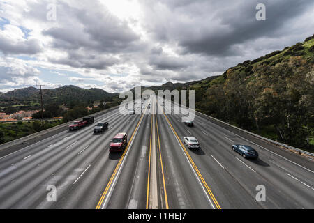 Los Angeles, California, USA - March 21, 2019:  Spring storm clouds over the 118 freeway below the Santa Susana Pass in the San Fernando Valley. Stock Photo