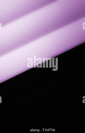 Elegant striped purple and black background pattern fading into white space Stock Photo