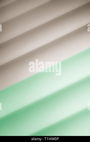 Elegant striped brown and green background pattern fading into white space Stock Photo