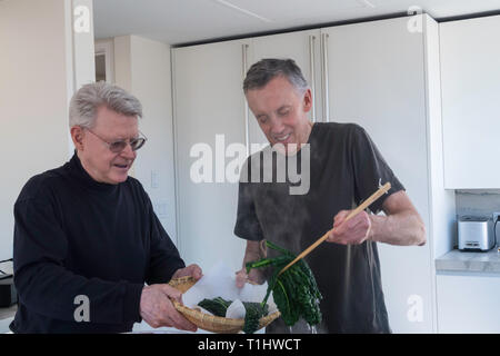 Two Mature menPreparing a Meal, USA Stock Photo