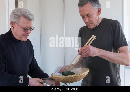 Two Mature menPreparing a Meal, USA Stock Photo