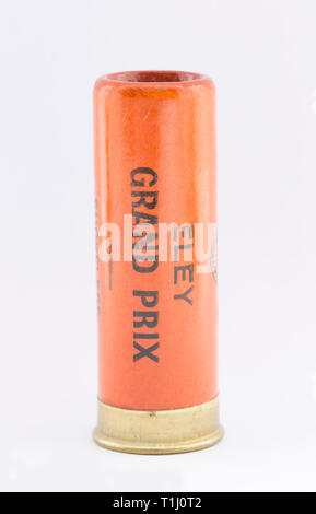 A paper case Eley Grand Prix 12 gauge, or bore, shotgun cartridge with a rolled turnover closure and loaded with No 4 lead shot pellets. Collecting sh Stock Photo