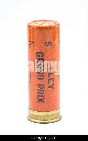 A paper case Eley Grand Prix 12 gauge, or bore, shotgun cartridge with a crimp closure loaded with No 5 lead shot pellets. Collecting shotgun cartridg Stock Photo