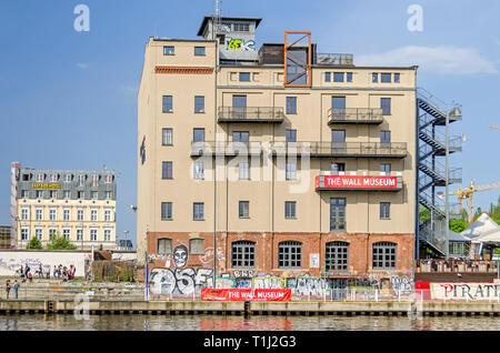 Berlin, Germany - April 22, 2018: Banks of the River Spree, building of the first and only Wall Museum and restaurant and eventlocation Pirates Stock Photo