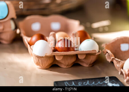 Closeup of tray of farm fresh brown and white multicolored eggs on display in farmer's market in London, UK Stock Photo