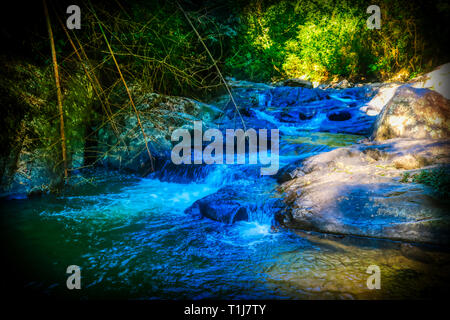 This unique photo shows the wild jungle waterfall and stunning nature also called Palau Waterfall Hua Hin in Thailand Stock Photo