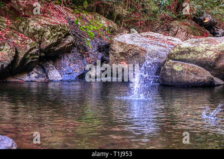 This unique photo shows the wild jungle waterfall and stunning nature also called Palau Waterfall Hua Hin in Thailand Stock Photo