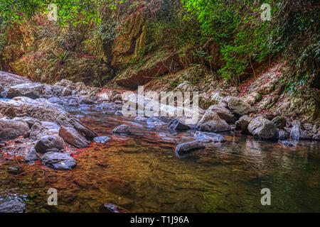 This unique photo shows the wild jungle waterfall and stunning nature also called Palau Waterfall Hua Hin in Thailand Stock Photo