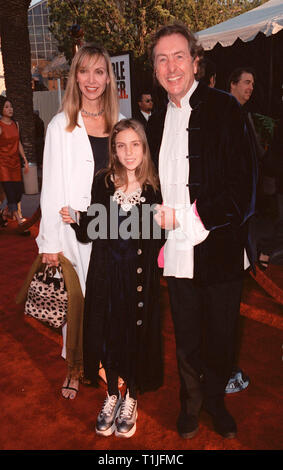 LOS ANGELES, CA - August 10, 1999:  Monty Python star ERIC IDLE with wife Tania & daughter Lily at the Los Angeles premiere of  'Bowfinger' which stars Eddie Murphy & Steve Martin. © Paul Smith / Featureflash Stock Photo