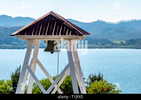 A church bell with the sea in the background Stock Photo