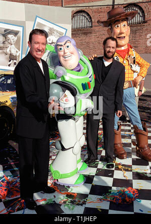 LOS ANGELES, CA. October 23, 1999:  Actors Tim Allen (left) & Tom Hanks with 'Toy Story' characters 'Buzz Lightyear' & 'Woody' whose voices they portray in the films. They were at a promotion in Hollywood to unveil three NASCAR racing cars themed to 'Toy Story 2' which opens next month.        © Paul Smith / Featureflash Stock Photo