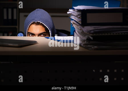 Thief trying to steal personal data in identity theft concept Stock Photo