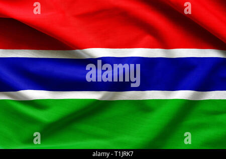 Gambia flag on satin texture. Stock Photo