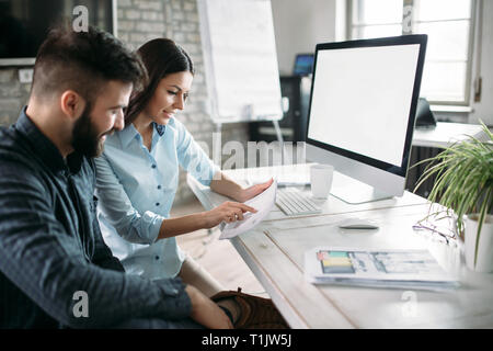 Young architects working on project in office Stock Photo