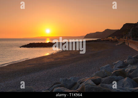 West Bay, Dorset, UK.  27th March 2019.  UK Weather.  Clear skies at sunset at West Bay in Dorset after another day of warm spring sunshine.  Picture Credit: Graham Hunt/Alamy Live News Stock Photo