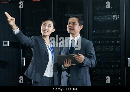 Technical personnel in machine room inspection Stock Photo
