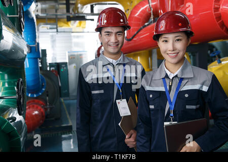 Technicians work in a factory Stock Photo