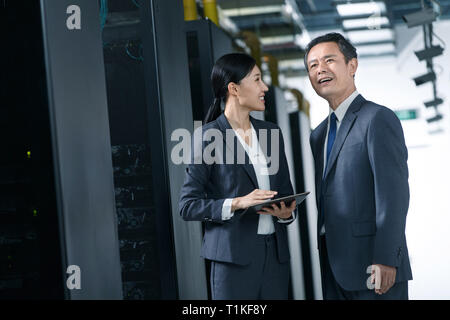 Technical personnel in machine room inspection Stock Photo