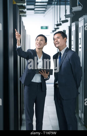 Technical personnel in machine room inspection Stock Photo