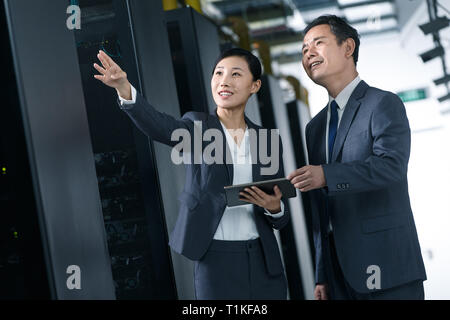 Technical personnel in machine room inspection Stock Photo
