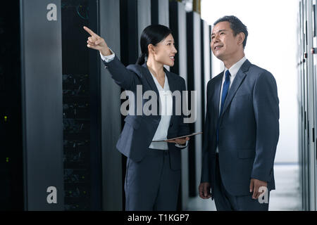 Technical personnel in machine room inspection Stock Photo