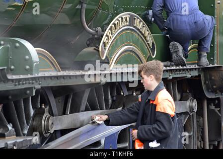 Locomotive cleaners work on Great Western locomotive 7802 Bradley Manor at the Severn Valley Heritage Railway Spring Gala 2019  Bewdley Worcestershire Stock Photo