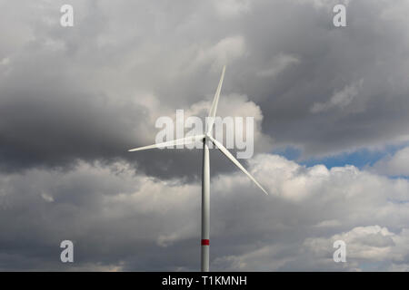 dramatic storm clouds around a windmill Stock Photo