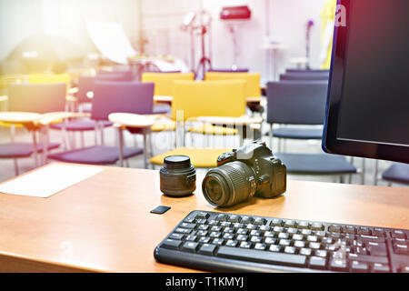 Place the teacher in photography school classroom and photo camera Stock Photo