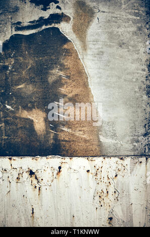 Old rusty stained metal board, toned abstract background or texture. Stock Photo