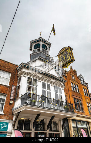 Guildford, United Kingdom - March 23, 2019: View of the guildhall historic clock in the city centre high street of the medieval city of Guildford, Eng Stock Photo