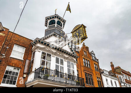 Guildford, United Kingdom - March 23, 2019: View of the guildhall historic clock in the city centre high street of the medieval city of Guildford, Eng Stock Photo