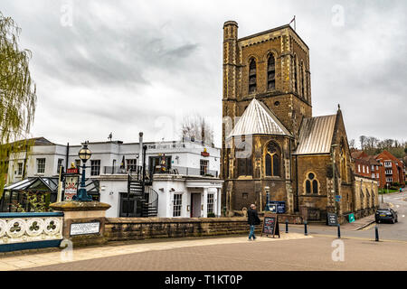 Guildford, United Kingdom - March 23, 2019: Street view of the St Nicolas Parish Church From The Town Bridge in the medieval city of Guildford, Englan Stock Photo