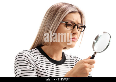 Young woman looking through a magnifying glass isolated on white background Stock Photo