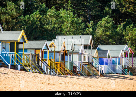 Colourful beach huts on Wells beach at Wells next the Sea on North Norfolk coast, East Anglia, England, UK. Stock Photo