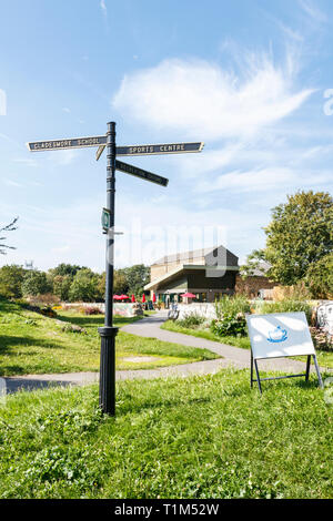 A signpost in Markfield Park, Tottenham, London, UK, the cafe and Beam Engine Museum in the background Stock Photo